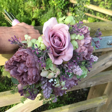 a wedding bouquet collection of pink and mauve flowers