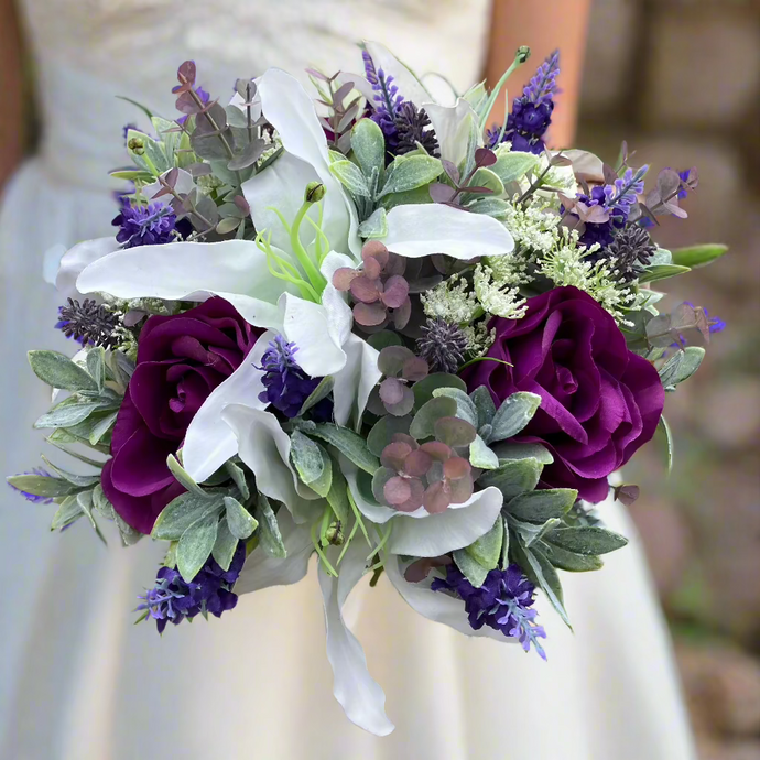A wedding bouquet featuring purple & white flowers