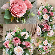 A teardrop bouquet of artificial pink and white roses