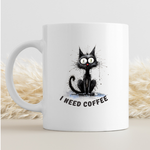 a ceramic gift mug from our black cat collection -' I need coffee'