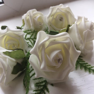 pack of ivory foam rose buttonholes