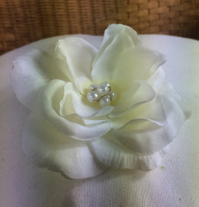 A large ivory rose on metal hair comb with pearl centre