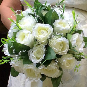 brides bouquet of artificial ivory roses