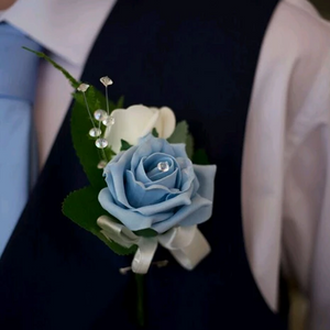 corsage featuring foam roses and crystal strands