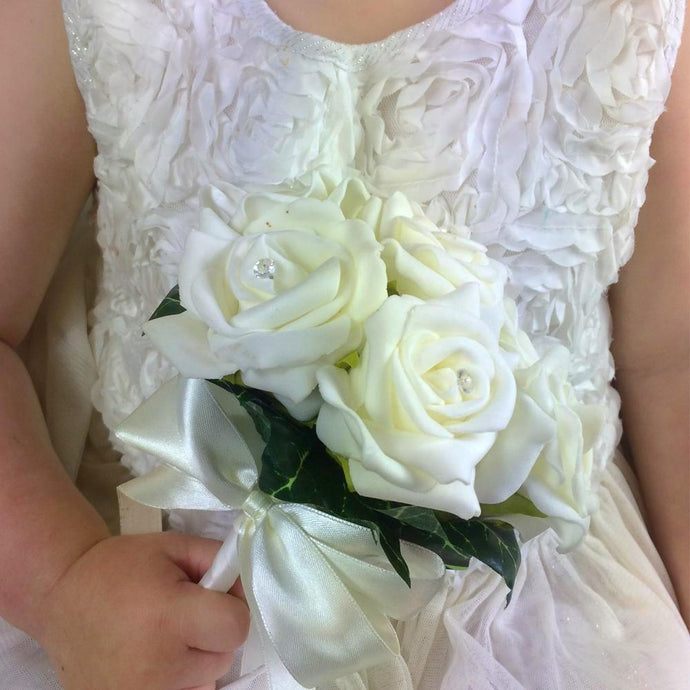 flower girl holding artificial ivory foam rose posy bouquet