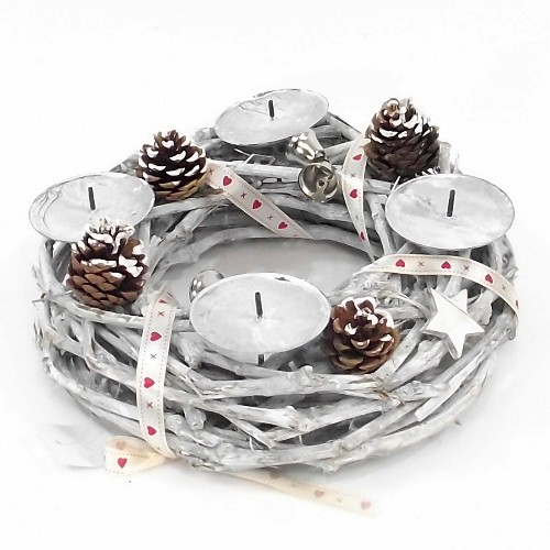 a wooden twiggy wreath candle holder with cones and spruce