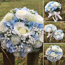 A brides bouquet of white/ivory and pale blue artificial silk flowers