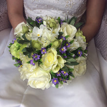 brides bouquet of silk ivory green and lilac flowers