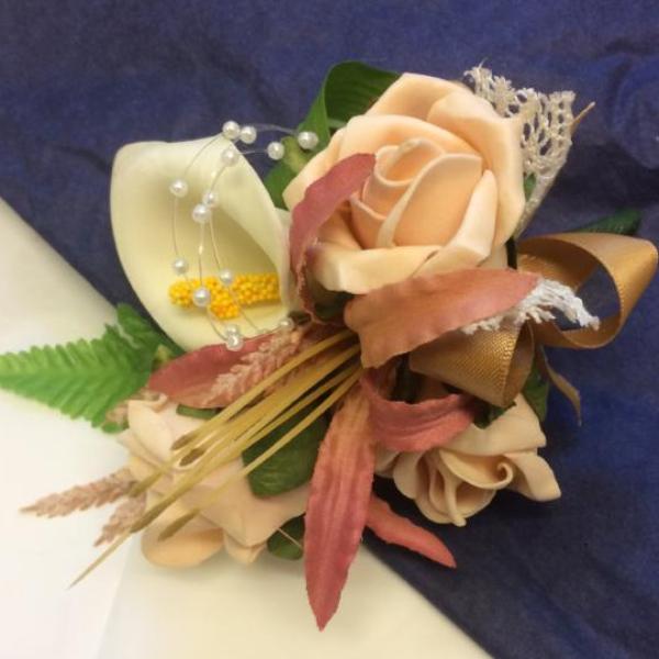 corsage of nerine, calla and roses