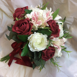 burgundy and ivory roses feature in this wedding bouquet