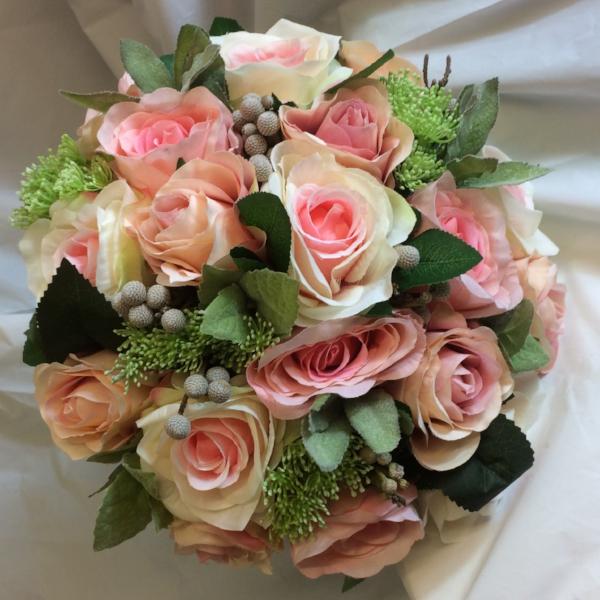 brides bouquet of pink and apricot roses