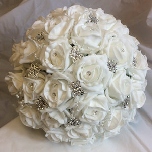 brides bouquet of white foam roses and silver emblishments