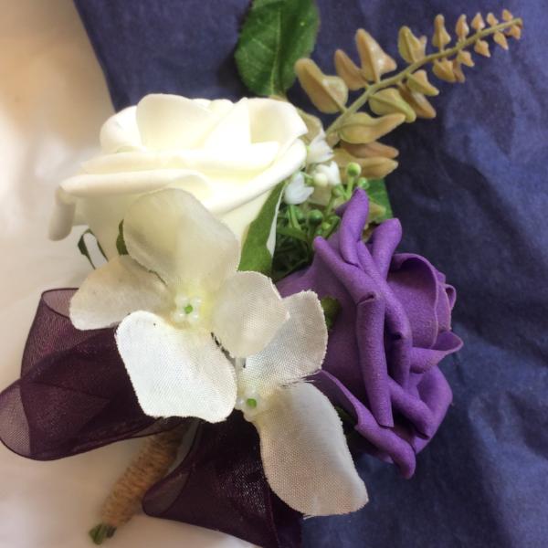 aubergine and ivory artificial rose corsage