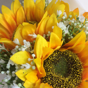 A bouquet collection of yellow sunflowers and gysophila