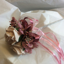 a bridesmaids flower wand with mocha pink roses and dusky pink hydrangea