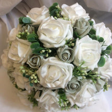 a wedding bouquet collection of white or ivory foam roses and foliage