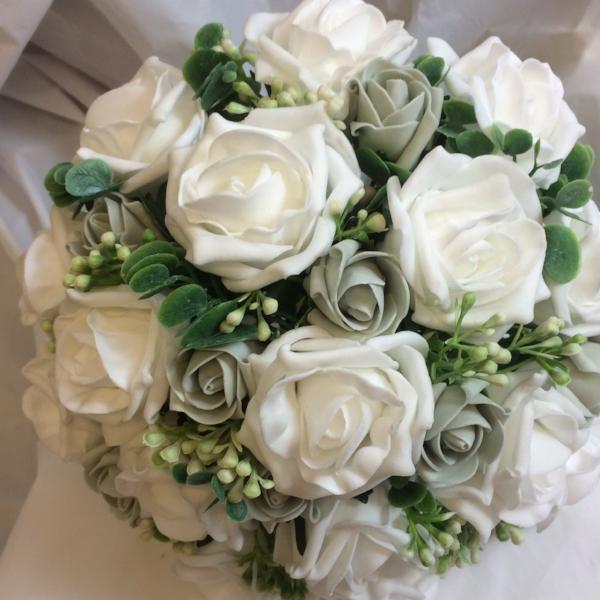 a wedding bouquet collection featuring ivory or white foam roses ...