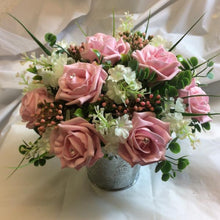 table centre of pink foam roses