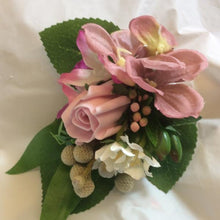 corsage of dusky pink flowers