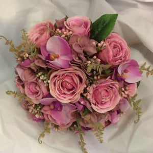 dusky pink brides wedding bouquet of artificial flowers