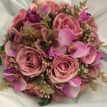 A wedding bouquet colllection of dusky pink roses, hydrangea and orchids