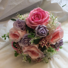 A wedding bouquet collection of pink and lilac roses & crystals