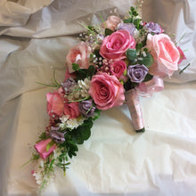 A wedding bouquet collection of pink and lilac roses & crystals