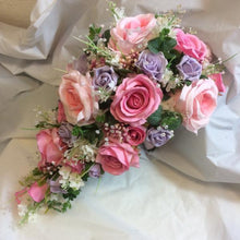 teardrop wedding bouquet of pink and lilac silk flowers