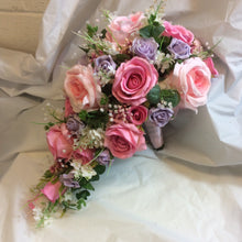 A wedding bouquet collection of pink and lilac roses & crystals