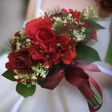 A brides bouquet featuring silk roses, hydrangea, gypsophila & foliage