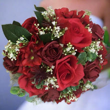a wedding bouquet of red and burgundy artificial flowers