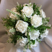 a wedding bouquet collection of white or ivory roses & lily of the valley