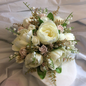 a brides bouquet of artificial silk ivory and dusky pink peony & roses