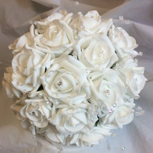 - a wedding bouquet collection featuring ivory rose flowers with crystal strands