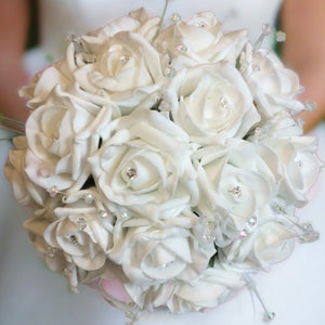 a wedding bouquet collection featuring ivory rose flowers with crystal strands