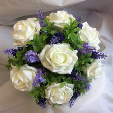 A wedding bouquet collection of artificial ivory & lavender flowers