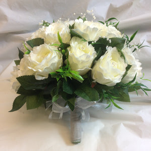 a wedding bouquet of ivory silk roses