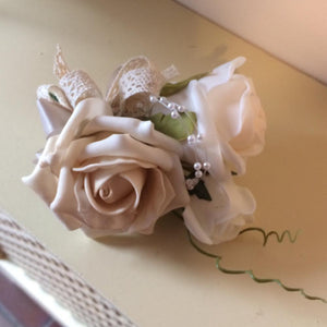 wedding corsage featuring foam roses in champagne, ivory and latte