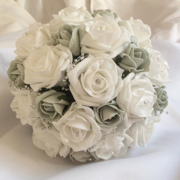 a wedding bouquet of foam roses in shades of silver grey and white