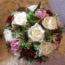 A wedding bouquet of artificial silk and foam rose flowers
