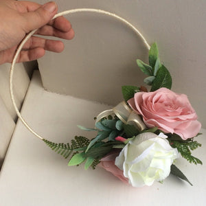 A bridesmaid flower hoop featuring artificial dusky pink silk roses