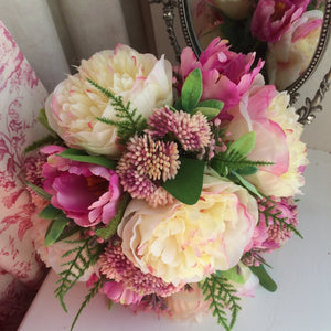 artificial wedding bouquet featuring peonies and tulips
