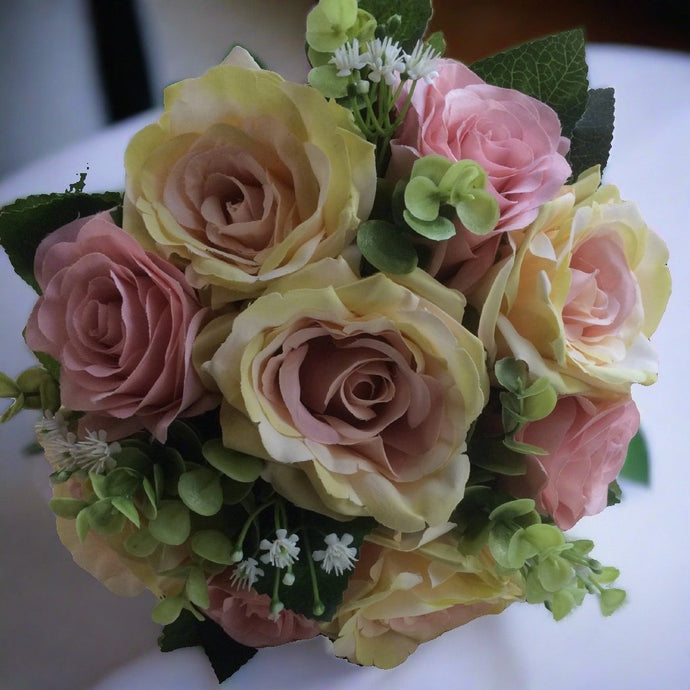a wedding bouquet of dusky pink silk roses