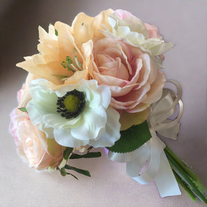 bouquet of silk flowers in shades of pink peach and blush 