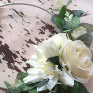 A bridesmaid flower hoop featuring artificial ivory dahlia & roses