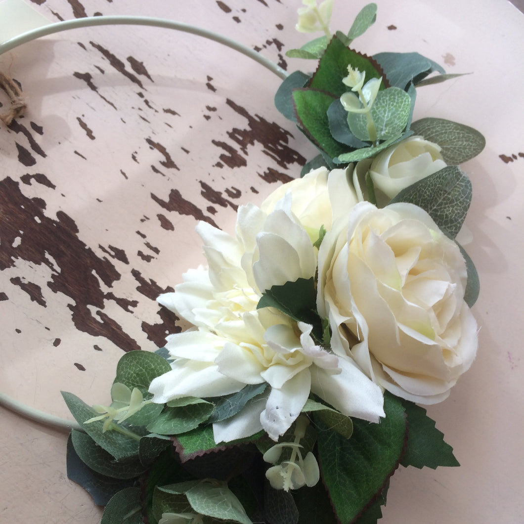 a bridesmaids hoop of artificial ivory flowers