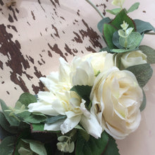 A bridesmaid flower hoop featuring artificial ivory dahlia & roses