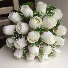 a wedding bouquet of artificial silk white roses