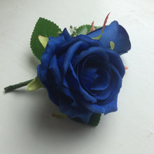 a pin on corsage featuring silk roses (different colours available)