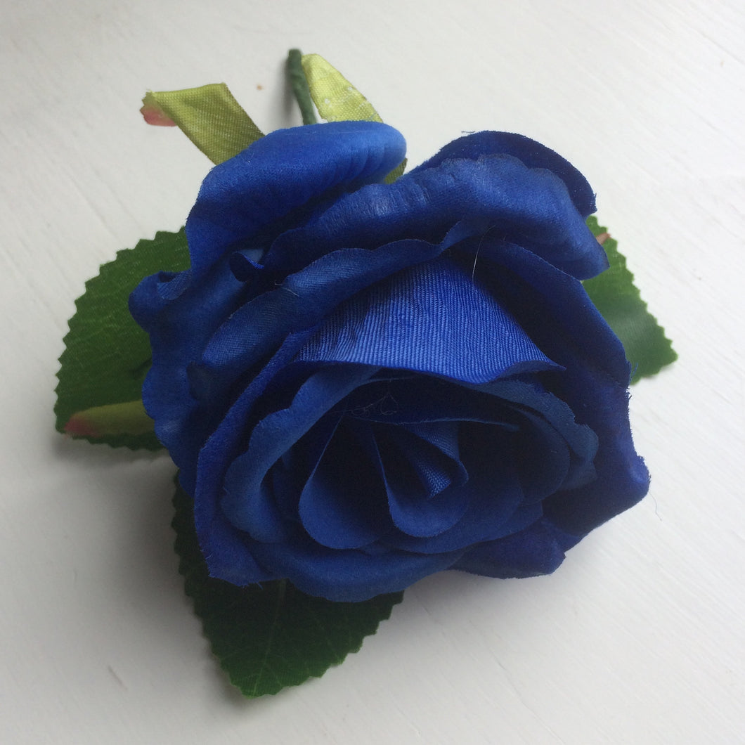 a traditonal silk rose buttonhole
